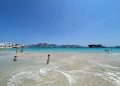 A shallow turquoise beach on Koufonisi in the Cyclades with swimmers