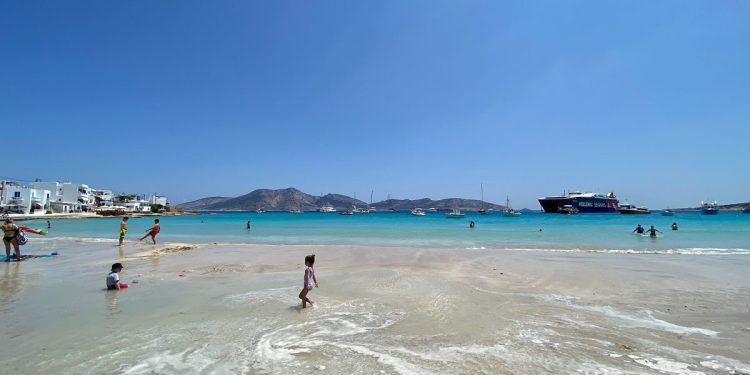 A shallow turquoise beach on Koufonisi in the Cyclades with swimmers